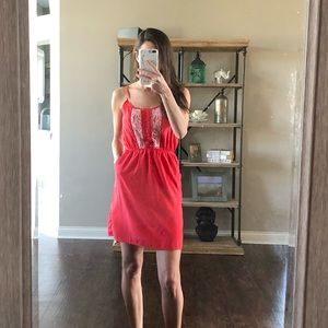 Coral summer dress with pockets and lace detail